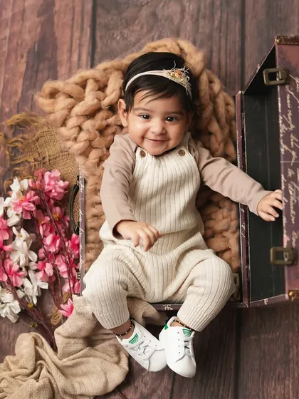 This little traveler is ready for an adventure! A sitter session is a great time to use fun props like this vintage suitcase.