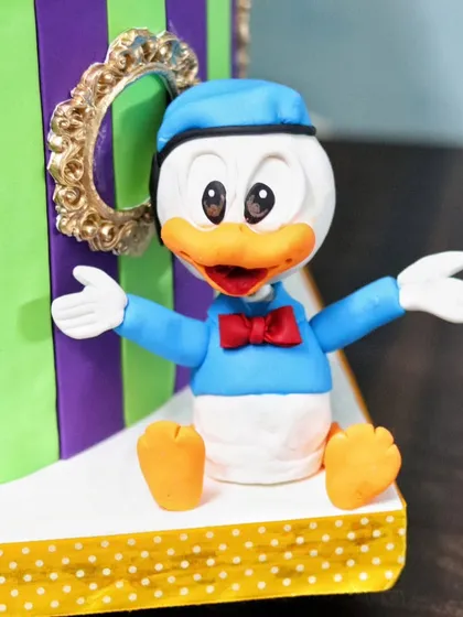 A close-up of the hand-sculpted Donald Duck figurine.