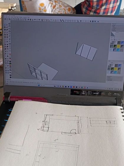 The design process often starts with a simple sketch and a digital model before moving to the physical prototype. This image shows the journey from a 2D idea to a 3D plan.