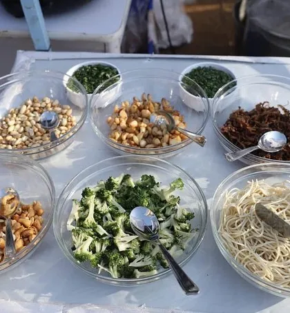 A variety of fresh toppings and ingredients for our live pasta and salad stations at the Mahalaxmi Racecourse event, showcasing our focus on quality and choice.