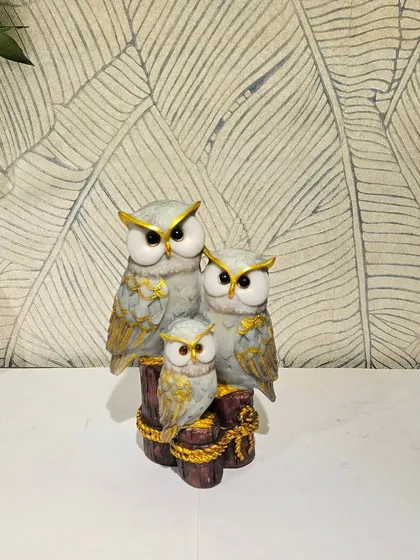 The same owl family design in a grey and gold finish.