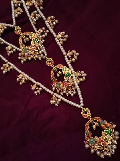 A closer look at the cascading layers of the 'Triveni' necklace. Each strand is thoughtfully designed to sit perfectly, offering a full bridal look in one piece.