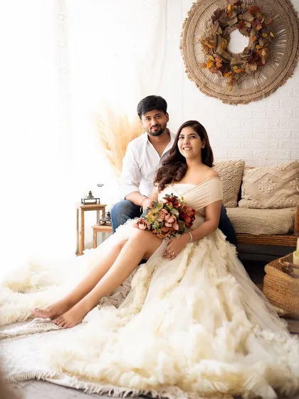 A relaxed and beautiful family portrait. The mother's stunning ruffled gown and the family's comfortable pose create an image that is both elegant and natural.