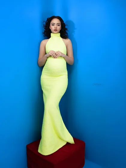Wrapping up this maternity style series with a radiant look. Motherhood deserves every bit of sparkle, and this neon dress against a bold blue is pure fashion.