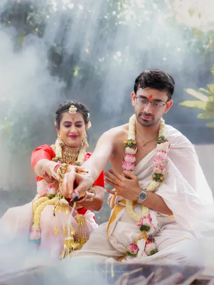 The couple performs a ritual together in front of the sacred fire, the smoke creating a mystical and timeless atmosphere.