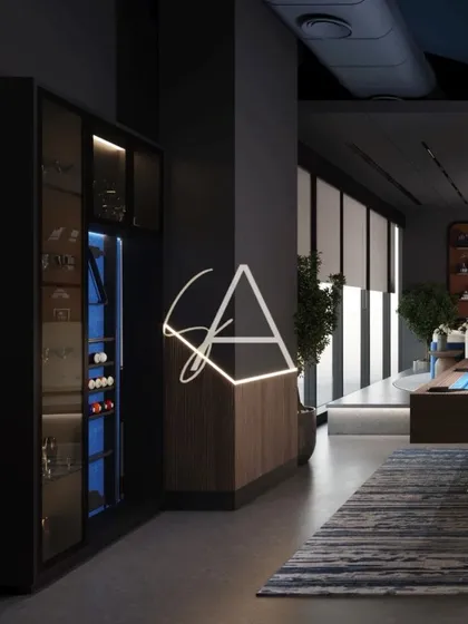 We designed this lounge and bar area as part of a private wellness center. The moody, dark tones, custom neon lighting, and sleek pool table come together to create a sophisticated space for relaxation and social connection after a workout.