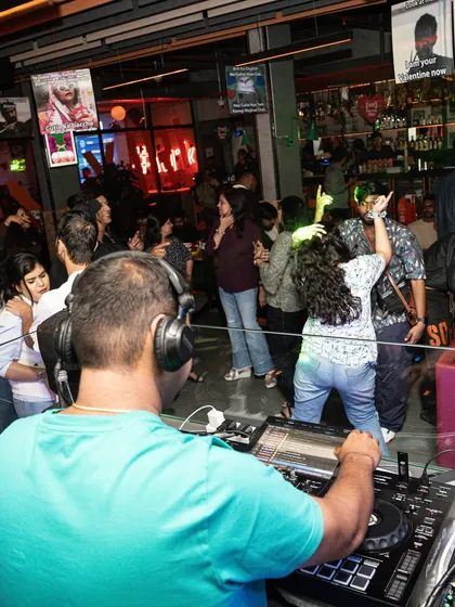 A view from behind the decks at Social E-City, watching the crowd enjoy the music.