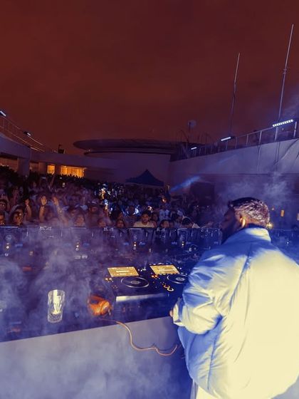 Ritviz on stage, surrounded by atmospheric smoke. The production is designed to make the headlining artist's performance as dramatic and impactful as possible.