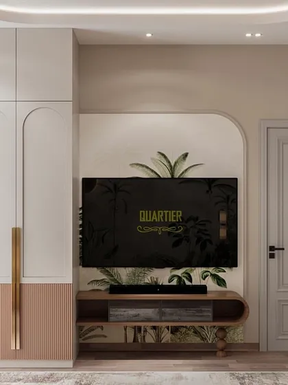 The TV unit and wardrobe design for the Cleo County guest bedroom. I used arched details and a two-tone finish on the wardrobe to add a touch of playful elegance, ensuring even guest spaces feel special.