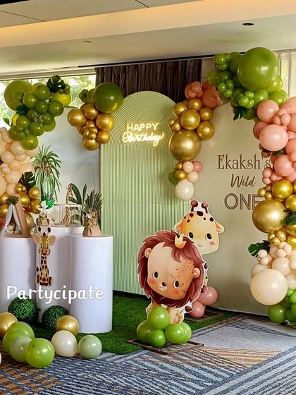 For Ekaksh's 'Wild One' party, I designed a backdrop with soft green tones and a large balloon arch. The cute lion and elephant cutouts made the setup feel extra special for a first birthday.
