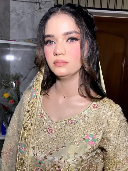 Soft, subtle, and stunning. This close-up highlights the delicate makeup and the client's radiant skin.