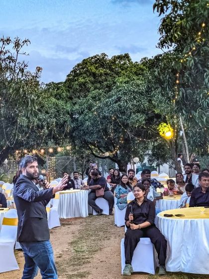 A guest speaker engages with the audience at our Doctors' Day event. It was an evening of shared stories, laughter, and community building.