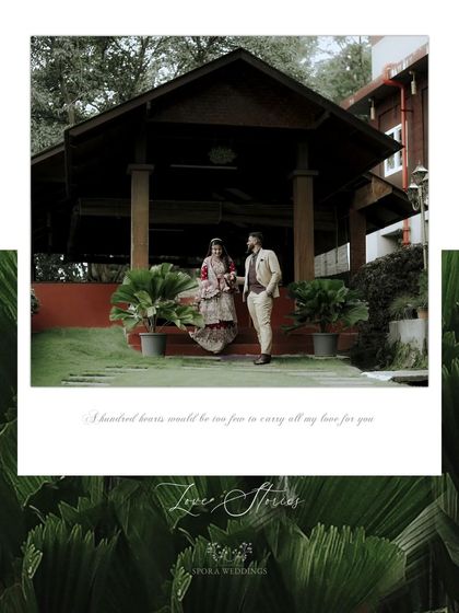 A beautifully framed shot of the couple at their reception venue, a perfect blend of architecture and nature.