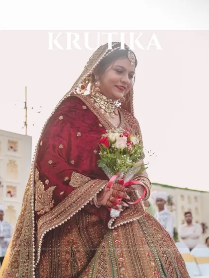 A picture-perfect moment of our stunning bride holding her bouquet as she walks down the aisle.
