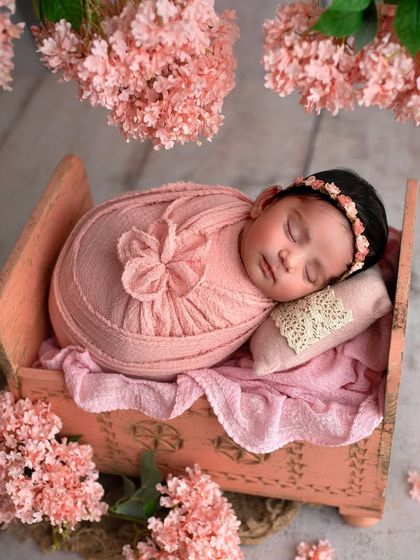 A slightly different view of this adorable pink floral setup. The little lace pillow and the texture of the wrap add so much charm.