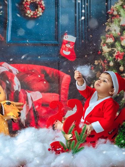 A moment of wonder, looking at the falling snow. These themed sessions are designed to be an experience for your child.