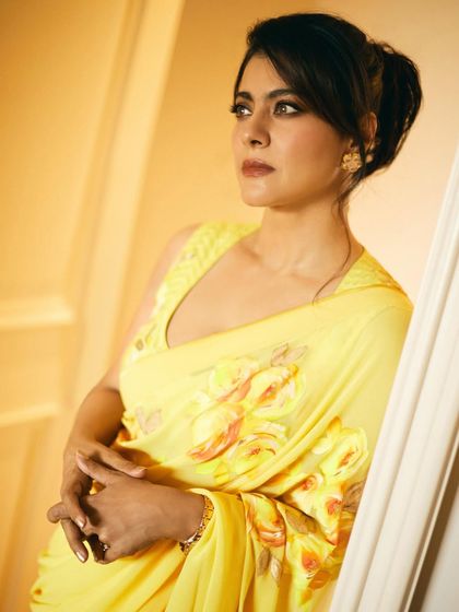 Another angle of the yellow floral saree, capturing a moment of quiet elegance.