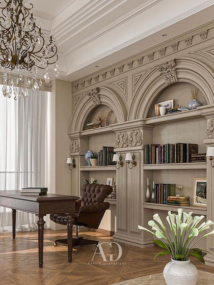 Our favorite corner. I designed this beautiful study with rich, deep tones to create a sense of warmth and sophistication. The ornate, carved bookshelves and classic leather chair are hallmarks of this timeless style.