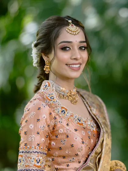 A close-up of the bride's happy face. Her makeup is soft and natural, enhancing her features and letting her joy shine through.