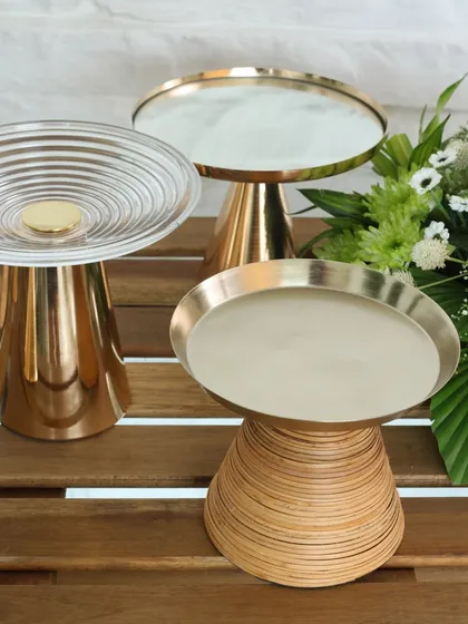 A trio of our exquisite high tea stands, showcasing the variety in our collection. From the Swirl Symphony to the glass-topped Vesper, each is designed to be a showstopper.