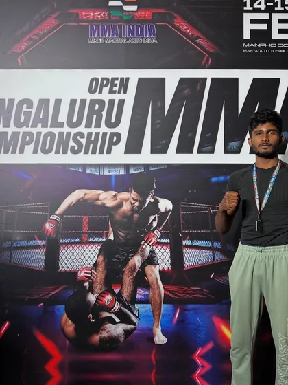 Suhas posing after winning a silver medal at the 7th Open Bengaluru MMA Championship. A minor setback on an exciting journey, we are already working to come back stronger.