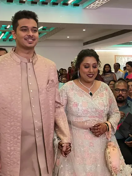 The couple's grand entrance, holding hands as they walk in. I also help choreograph epic entry dances to start the event with a bang.