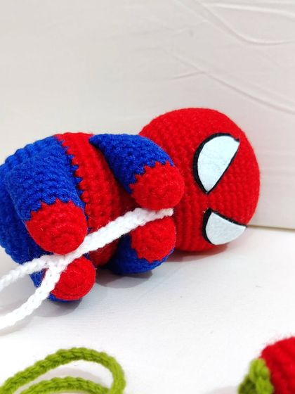 A close-up shot of the Spiderman figure, focusing on the details of his mask and body.