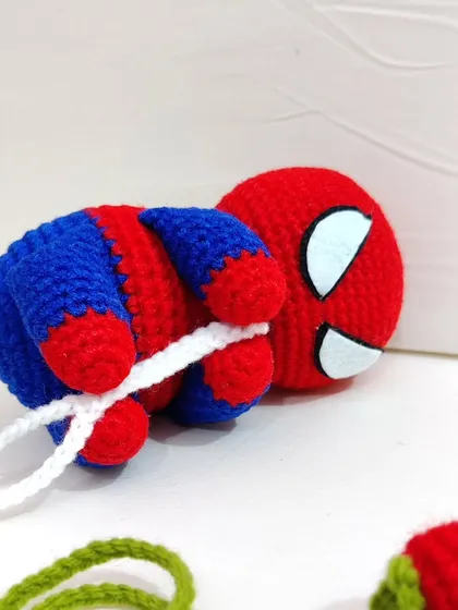 A close-up shot of the Spiderman figure, focusing on the details of his mask and body.