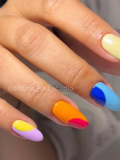 A detailed look at the color-blocked nails from the vibrant, mismatched set.