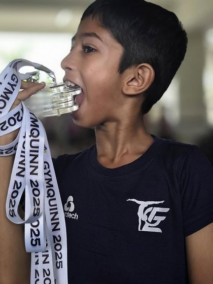 A classic winner's pose! Kayden showing off his five silver medals. This reflects the discipline and hard work we instill in our athletes.