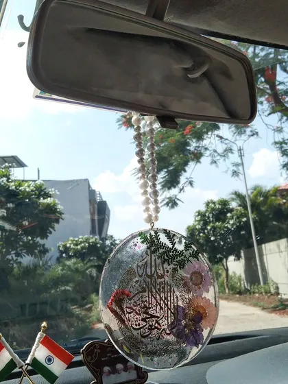 The Islamic car hanging as it's meant to be, hanging from a rearview mirror.