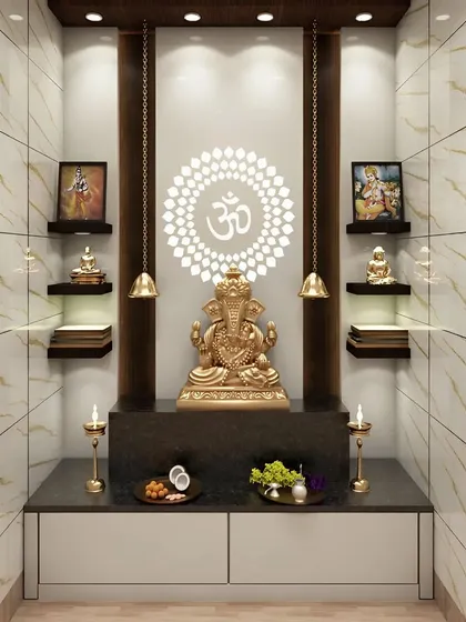 We designed this pooja space within a dedicated niche, using marble-finish tiles with golden veins to create a luxurious feel. The backlit OM panel serves as a divine focal point, complemented by hanging bells and floating shelves for a clean, modern, and Vastu-compliant layout.