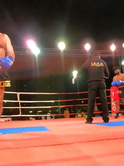 Our fighter stands ready in the ring, focused and waiting for the next round of his pro bout.