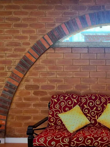 A close-up of the brick arch detail in a living area, highlighting the craftsmanship and the warm, varied tones of the bricks.