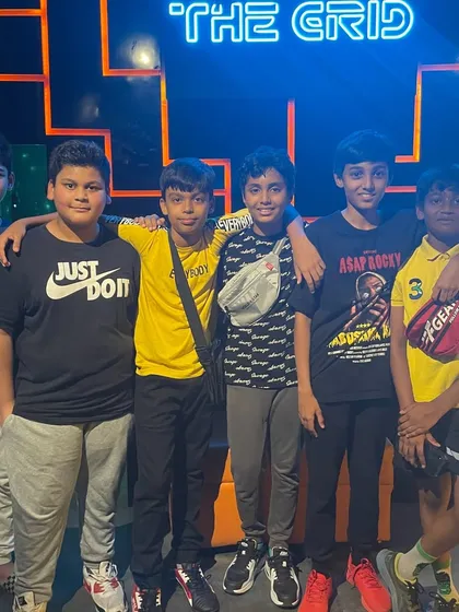 A group of young boys posing together at The Grid.