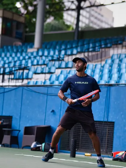 A strong, balanced stance while waiting to return a serve. This is your base of power and stability, allowing you to handle fast serves and attack the second ball.