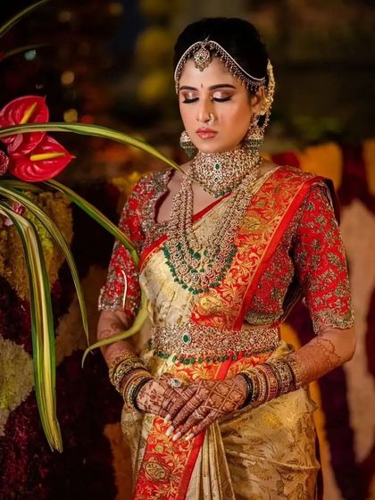 A duplicate of 236, capturing the bride's serene beauty and her detailed mehndi.