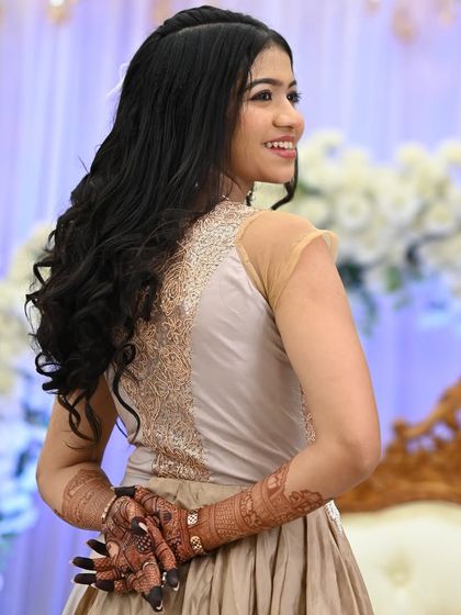 A beautiful shot of a guest showing the back of her hands, adorned with a rich henna stain.