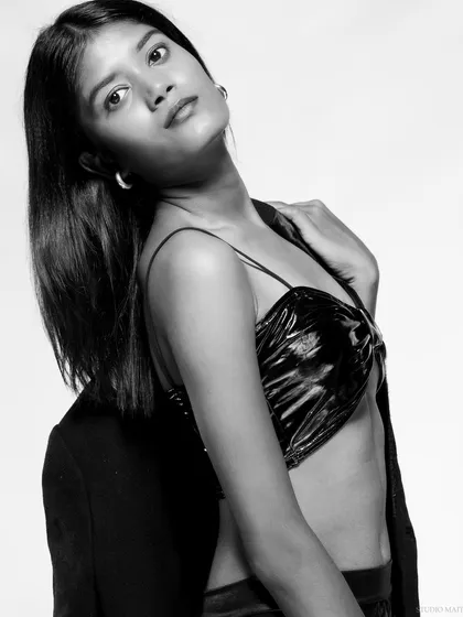 A black and white version of an editorial fashion shot. The monochrome look gives it a classic, moody feel, perfect for a magazine spread.