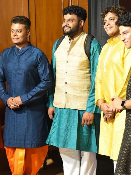 Standing with other performers at a cultural event. I am always grateful to share the stage with such talented musicians.