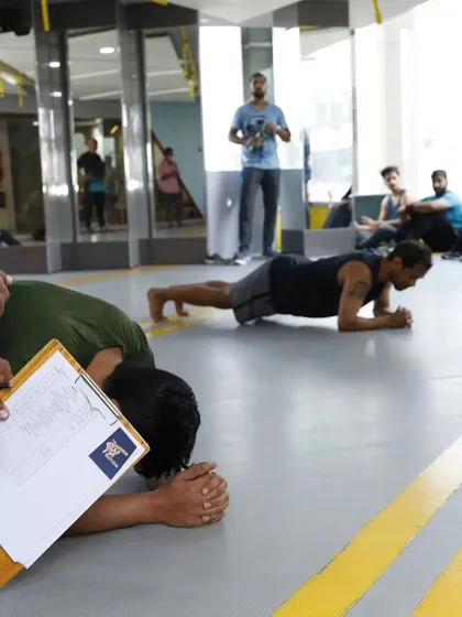 Tracking progress and pushing limits during our Plank Challenge. This image captures the intensity and spirit of our community events, where every second counts.