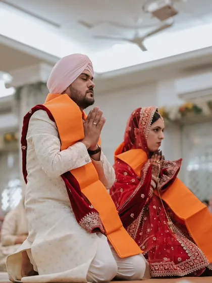 A moment of serene prayer during a Sikh Anand Karaj ceremony. It's in these quiet, spiritual moments that you find the true depth of the commitment being made. I have experience capturing the sanctity of diverse wedding rituals.