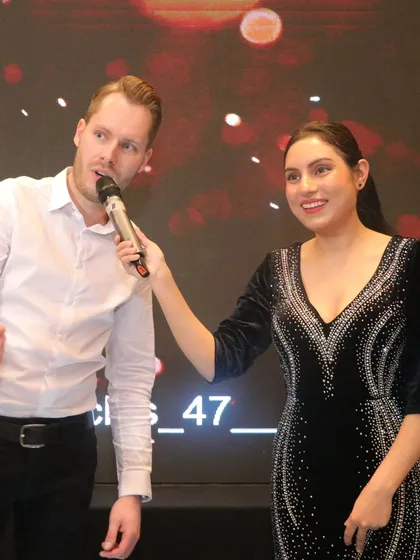 Making sure everyone's voice is heard is key to an inclusive event. I enjoy moving through the audience and passing the mic, giving guests a chance to share a story or participate directly, which is especially important for engaging mixed Indian and international crowds.