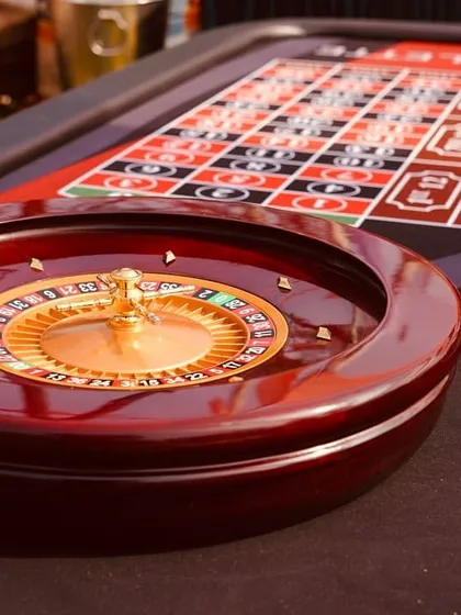 A close-up of a roulette wheel, part of the casino games setup. These interactive elements are a huge hit with guests and provide hours of entertainment.