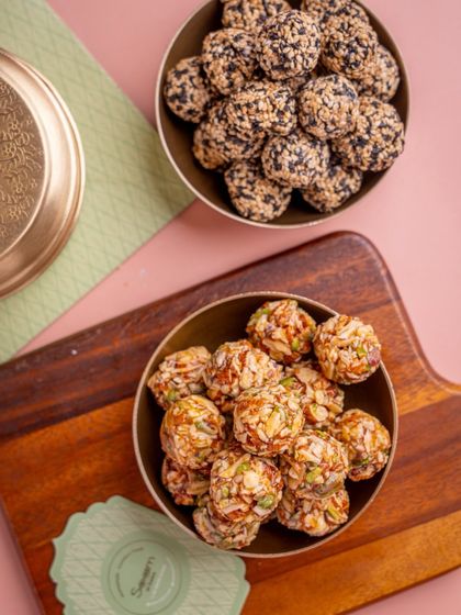 Laddoos that do more than just taste good. This image shows two types of my wholesome laddoos, one with sesame and another with mixed nuts, both packed with nourishment.