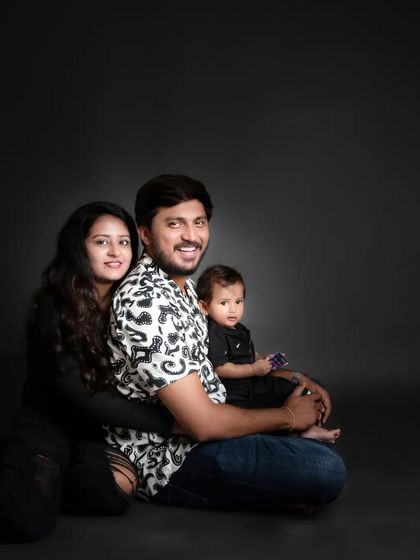 Another take on the classic family pose, showing how we can capture different dynamics and personalities even in a simple studio setting.