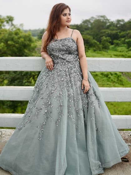 This beautiful grey ball gown with scattered silver embellishments is perfect for a dreamy engagement or pre-wedding shoot.
