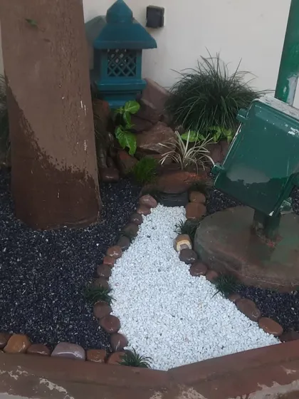 Another view of a custom stone garden I created. The design incorporates a miniature pagoda and a dry riverbed path, turning an unused corner into a point of interest.