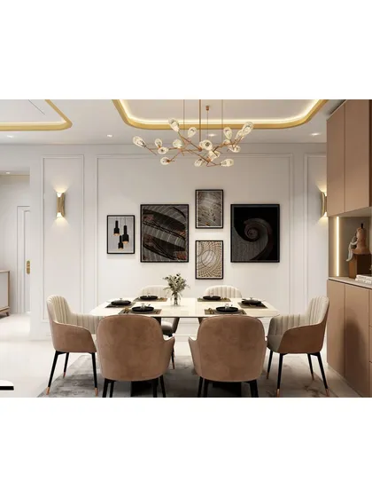 An elegant dining area designed for memorable gatherings. This space features a sophisticated gallery wall, a modern statement chandelier, and gold-accented cove lighting, all working together to create a luxurious and welcoming ambiance for you and your guests.