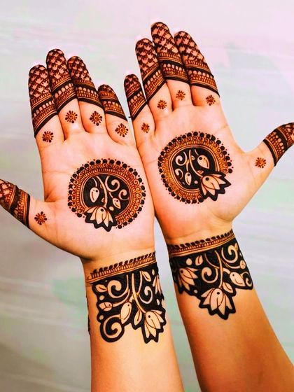 A simple and elegant design with a floral mandala on each palm and matching wrist cuffs. This is a timeless look that is always in style.